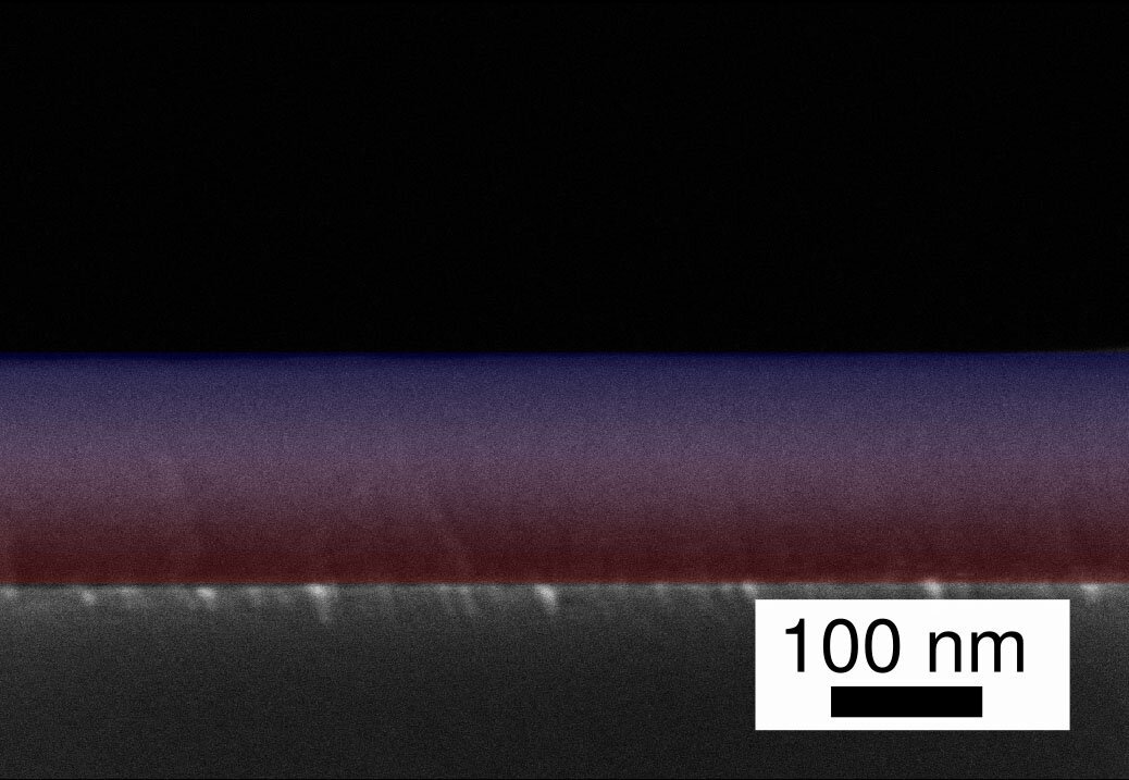 Using an elaborate process, the research team has joined two polymers at the nanoscale in a flowing process: The transition from PV3D3 to Teflon (PTFE) in the scanning electron microscope image of the gradient layer is marked here as the transition from red to blue. Courtesy: Kiel University.