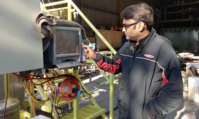 Lead researcher Associate Professor Kalpit Shah, with the novel reactor developed and patented by RMIT University. Courtesy: RMIT University