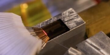 Extend the Spectrum, Laser Light glows on photonics chip, Nano Digest.