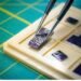 Stressed crystal creates nanoscale patterns on chip materials at room temperature